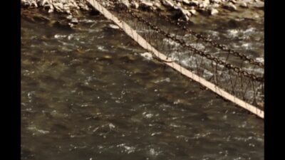 Nepal 1970s, People passing bridge during daytime
