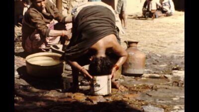 Nepal 1970s, Women washing bowls and bathing in outside