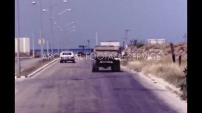 Mexico 1970s, Street view with stand lights from car during daytime