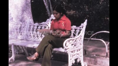 Mexico 1970s, Woman reading something in bench of park