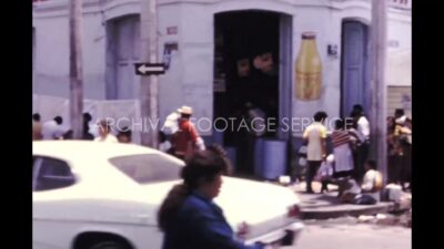 Mexico 1970s, Street view with buildings beside car parking