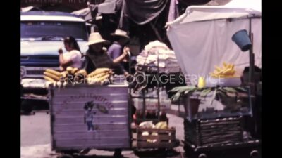 Mexico 1970s, Clock tower view beside street market at daytime