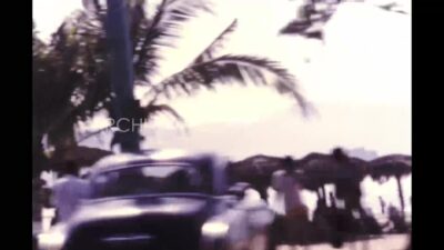 Mexico 1970s, Street side trees and vintage car parking view
