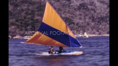 Mexico 1970s, Two adult riding sun fish sailing boat