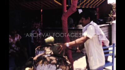 Mexico 1970s, Sellers selling green coconut and serving people