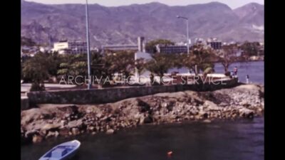 Mexico 1970s, bahia de acapulco with speedboat beside land