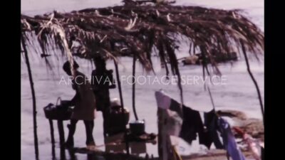 Mexico 1970s, Woman washing clothes in river during afternoon