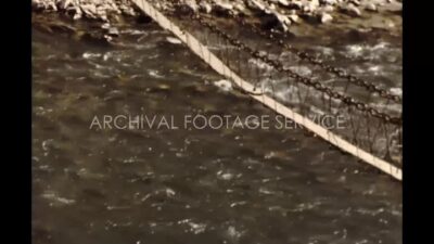 Nepal 1970s, People passing bridge during daytime