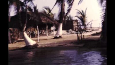 Mexico 1970s, Children bathing in water in sea beach area