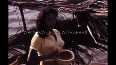 Mexico 1970s, Girl eating watermelon beside river