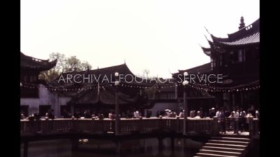 China 1980s, View of temple with crowd of people at daytime