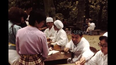 China 1980s, Group of people working together in table in outside