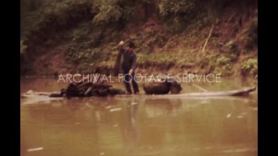 China 1980s, A steamer moving in river beside trees during daytime