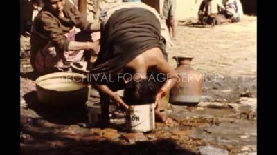 Nepal 1970s, Women washing bowls and bathing in outside