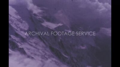 Italy 1970s, Daytime aerial view of alps covered with snow